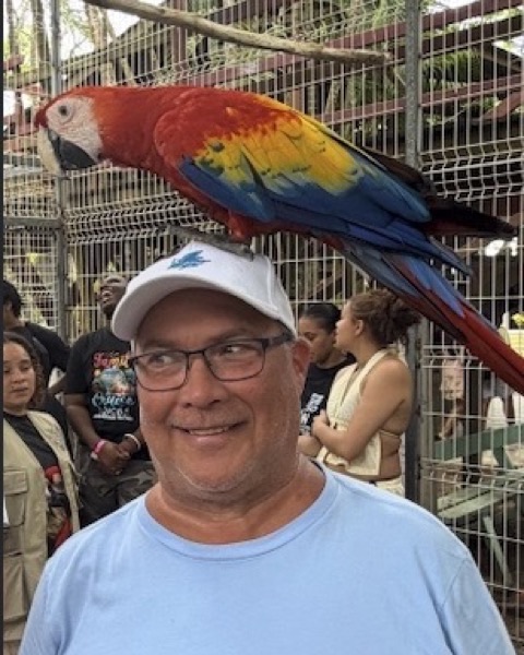 Brent Beasley with a scarlet macaw