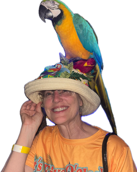 Lori Judd with a blue and gold macaw